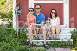 Portrait of Caucasian and Chinese Couple with Their Mixed Race Y