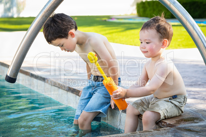 Young Mixed Race Chinese and Caucasian Brothers Playing At The P