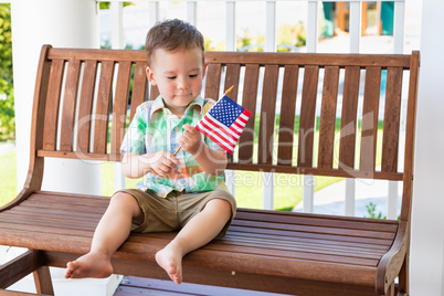 Young Mixed Race Chinese and Caucasian Boy Playing With American