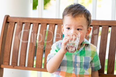 Mixed Race Chinese and Caucasian Boy Enjoying A Glass Of Water