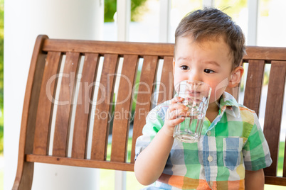 Mixed Race Chinese and Caucasian Boy Enjoying A Glass Of Water