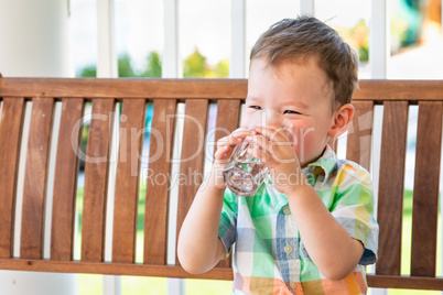 Mixed Race Chinese and Caucasian Boy Enjoying A Glass Of Water