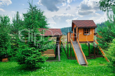 Children's playground in a cozy forest zone.