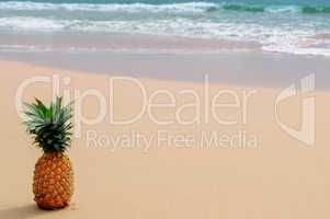 Fresh pineapple on the beach. Tropical summer delights.