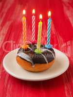 Birthday candles on a donut