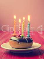 Birthday candles on a donut