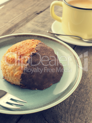 Tasty organic macaroon with cup of coffee