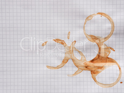 Rings of coffee cup on paper