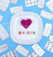 white square ceramic plate with red heart and inscription health