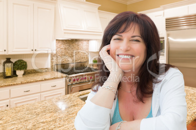 Attractive Middle Aged Woman Portrait Inside Kitchen At Home