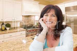 Attractive Middle Aged Woman Portrait Inside Kitchen At Home