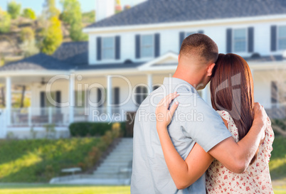 Affectionate Military Couple Looking at Beautiful New House