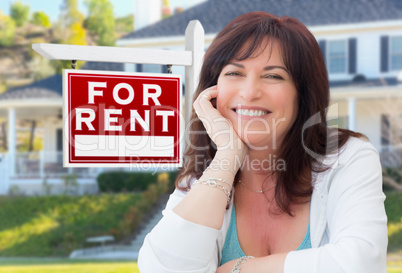 Middle Aged Woman In Front of House with For Rent Real Estate Si