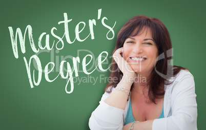 Master's Degree Written On Green Chalkboard Behind Smiling Middl