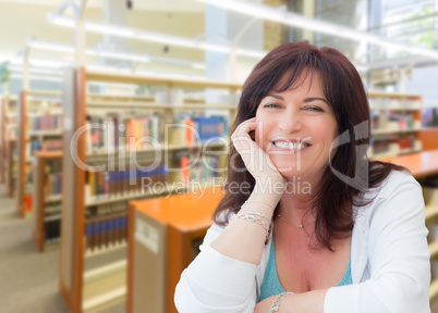 Smiling Middle Aged Woman Inside The Library