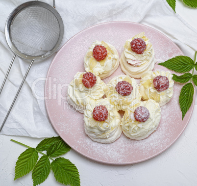 cakes made of egg white and whipped white cream with raspberries