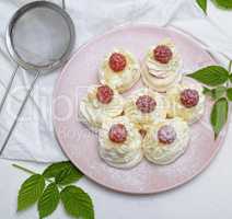 cakes made of egg white and whipped white cream with raspberries