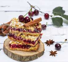 stack of baked cake with cherry berries