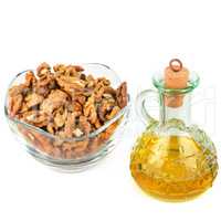 Oil of walnut and nut fruit isolated on white background.