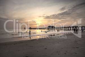 Hazy sunset over the Naples Pier in summer