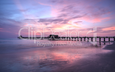 Pink and purple sunset over the Naples Pier