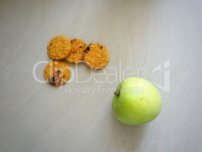 Four cookies and a green apple