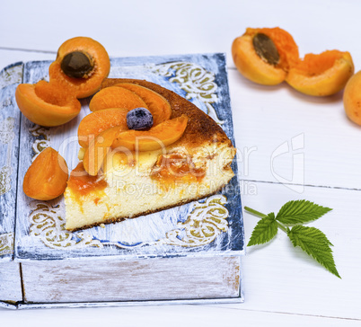baked piece of cottage cheese pie and apricot