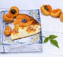 baked piece of cottage cheese pie and apricot