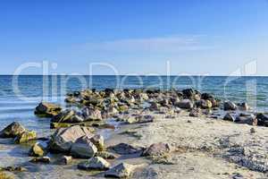 View of the Black Sea with large stones on a summer sunny day, K