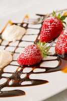 Close up of strawberries with whipped cream and decorations