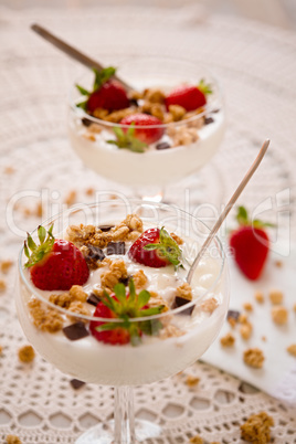 Dessert with strawberries cereals and chocolate flakes