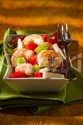 Shrimp salad over a green napkin