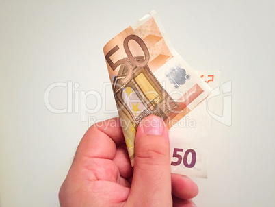 Hand holding a 50 euro banknote