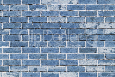 Wall from light blue brick background