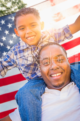 African American Father and Mixed Race Son Piggy Back with Ameri