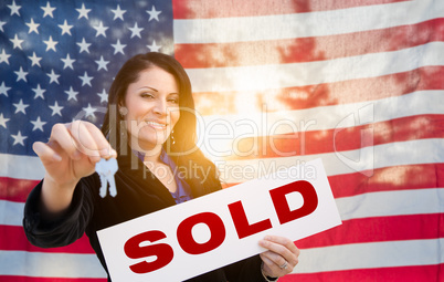 Hispanic Woman House Keys and Sold Sign In Front of American Fla