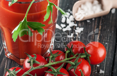 Closeup of tomato juice and cherry tomatoes