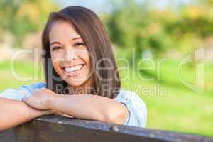 Beautiful Asian Eurasian Girl Resting on Fence