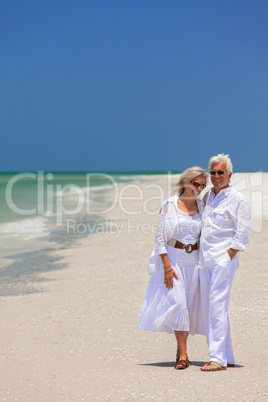 Happy Senior Couple Laughing Embracing on a Tropical Beach