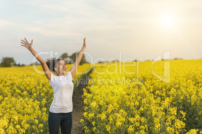 Mixed Race African American Girl Teenager Celebrating In Yellow