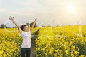 Mixed Race African American Girl Teenager Celebrating In Yellow