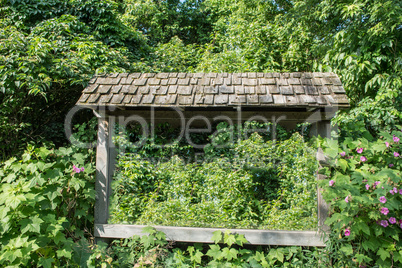 A frame and a roof  in the forest