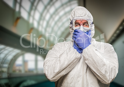 Man Covering Mouth With Hands Wearing HAZMAT Protective Clothing