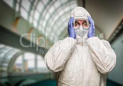 Man Holding Head With Hands Wearing HAZMAT Protective Clothing I