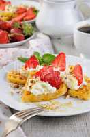 Belgian waffles with whipped cream and strawberries