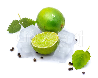 Fresh lime and melissa isolated on white