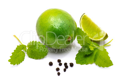 Fresh lime and melissa isolated on white