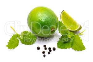 Fresh lime and melissa isolated on white