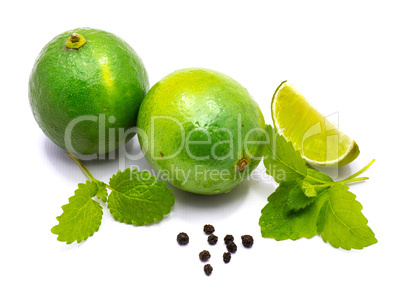 Fresh lime and melissa isolated on white