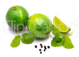 Fresh lime and melissa isolated on white